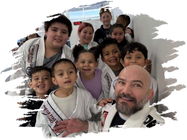 Professor Daniel Pinheiro with Team Shark BJJ kids class students